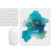Computer keyboard and mouse next to a colorful abstract watercolor painting