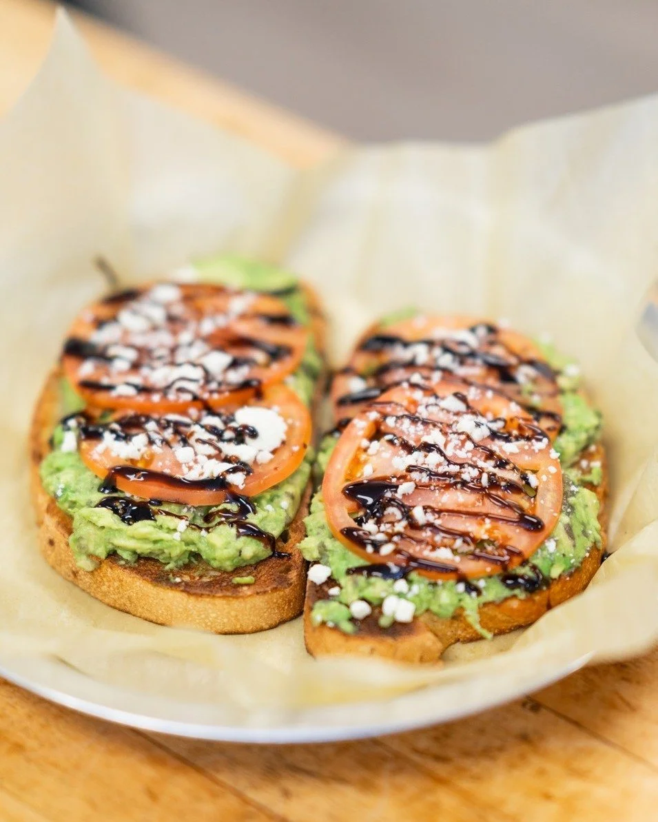 Happy #NationalAvocadoDay! 

Celebrate with our Avocado Toast! Fresh avocado mashed with garlic and spread over sourdough bread, then topped with roasted tomatoes, feta cheese, and balsamic glaze.

Feeling extra? Add an egg for an additional cost! 🍳