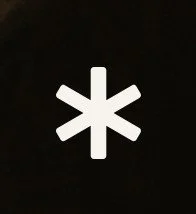White asterisk symbol on a black background.