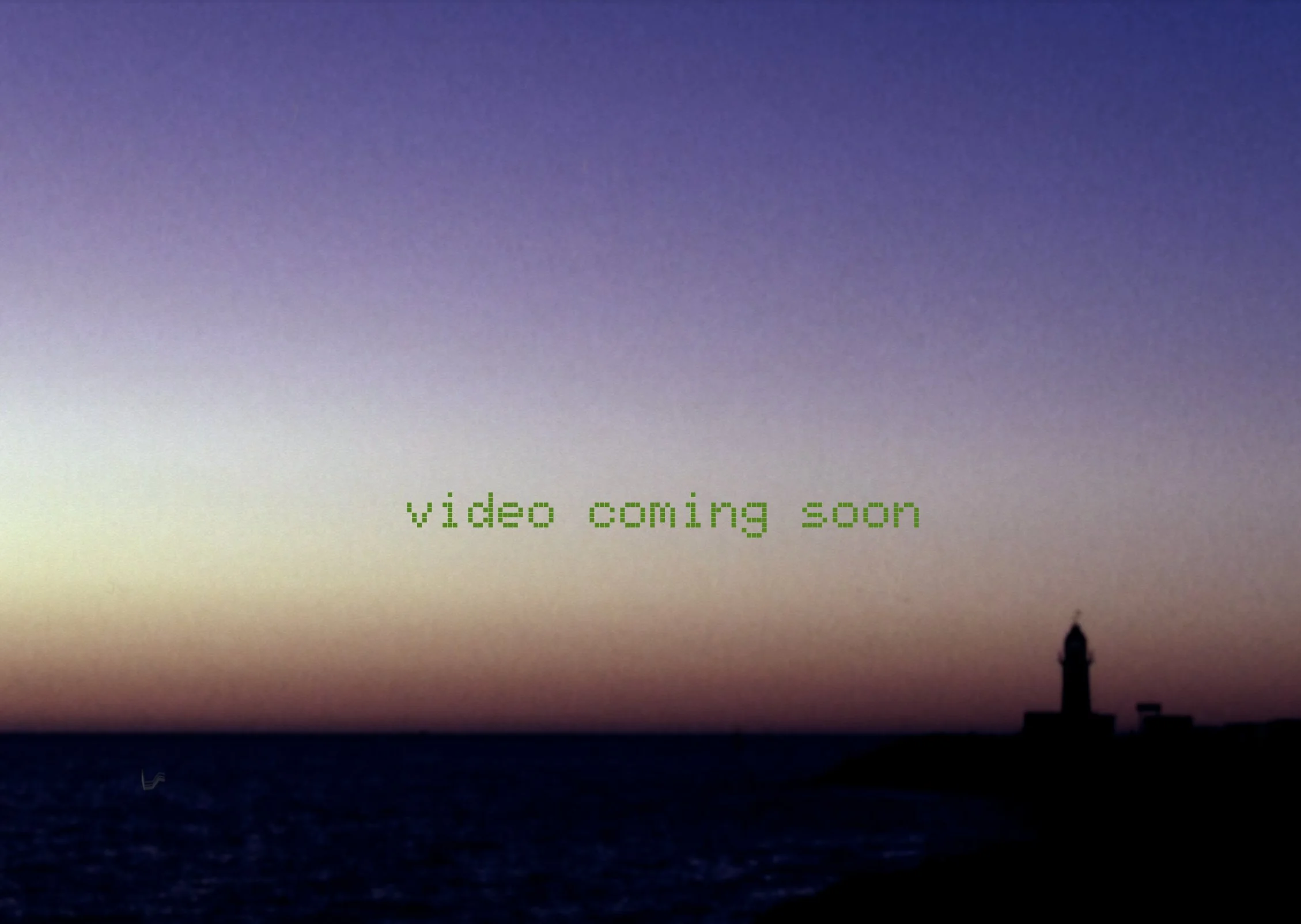 A sunset over the ocean with dark silhouettes of buildings in the foreground. The sky features a gradient from blue to purple to yellow. The text on the image reads 'video coming soon' in green.