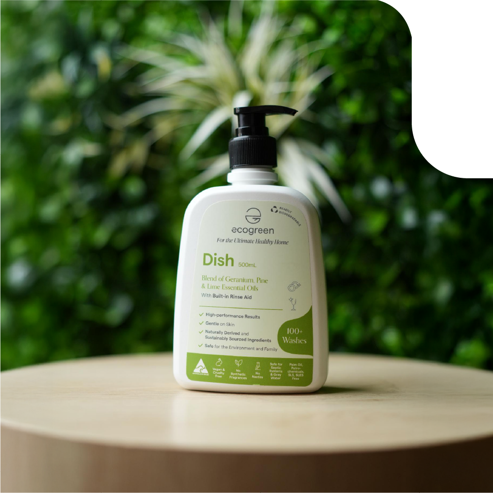 500ml Ecogreen Dish bottle on wooden stand with greenery in the background.