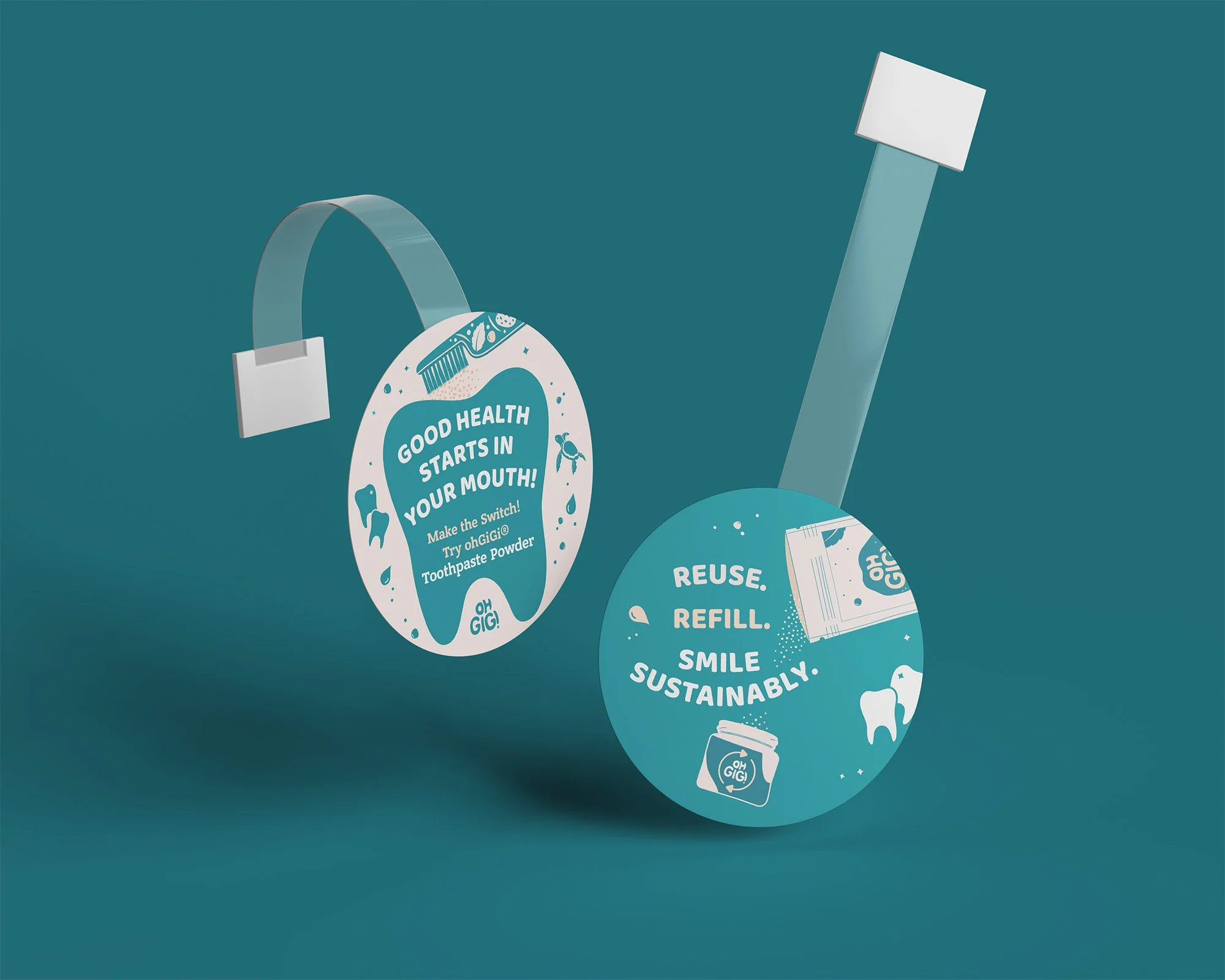 Two ohGiGi shelf wobblers, highlighting the dental products.