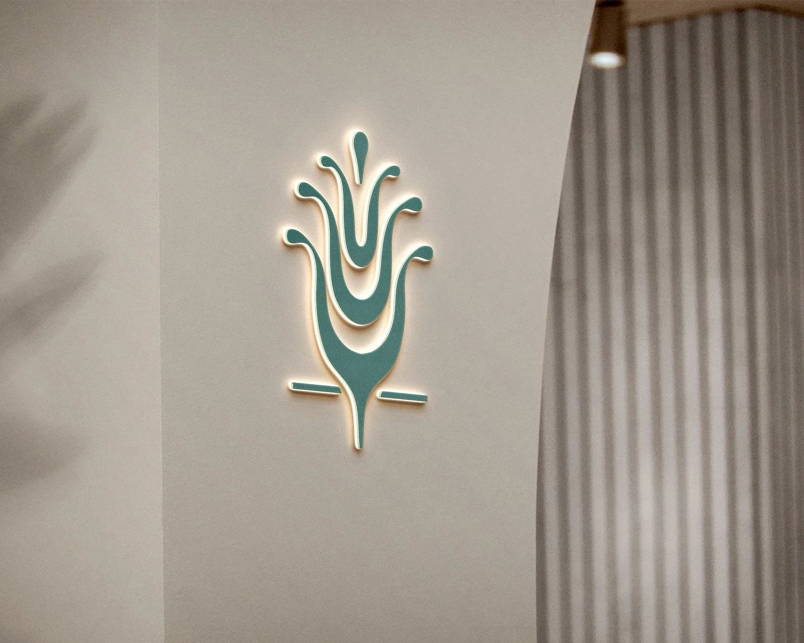 3D green sign of Lumera Skin Clinic logo icon on clinic wall.