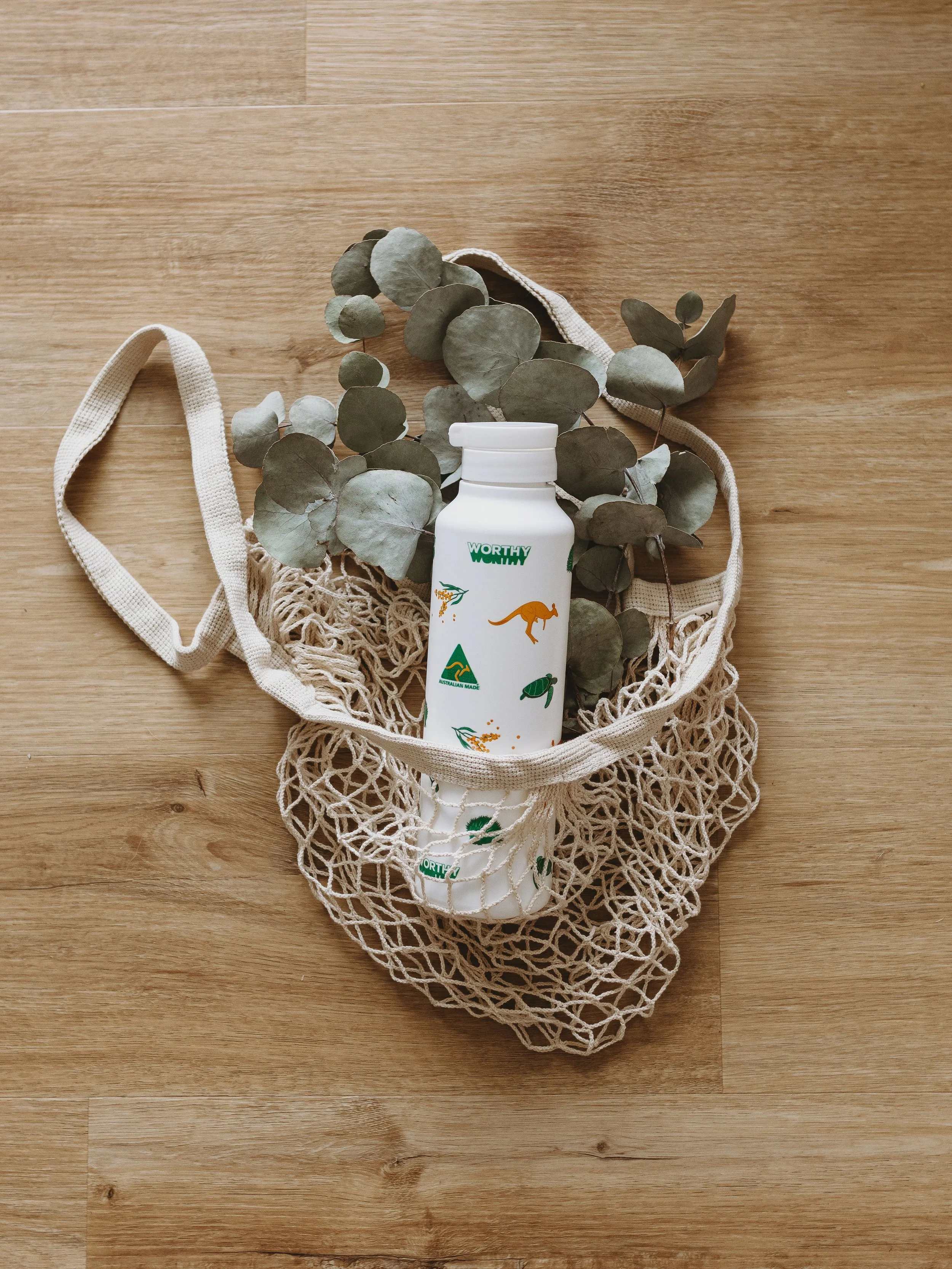 White Worthy bottle featuring Australian-themed surface pattern.