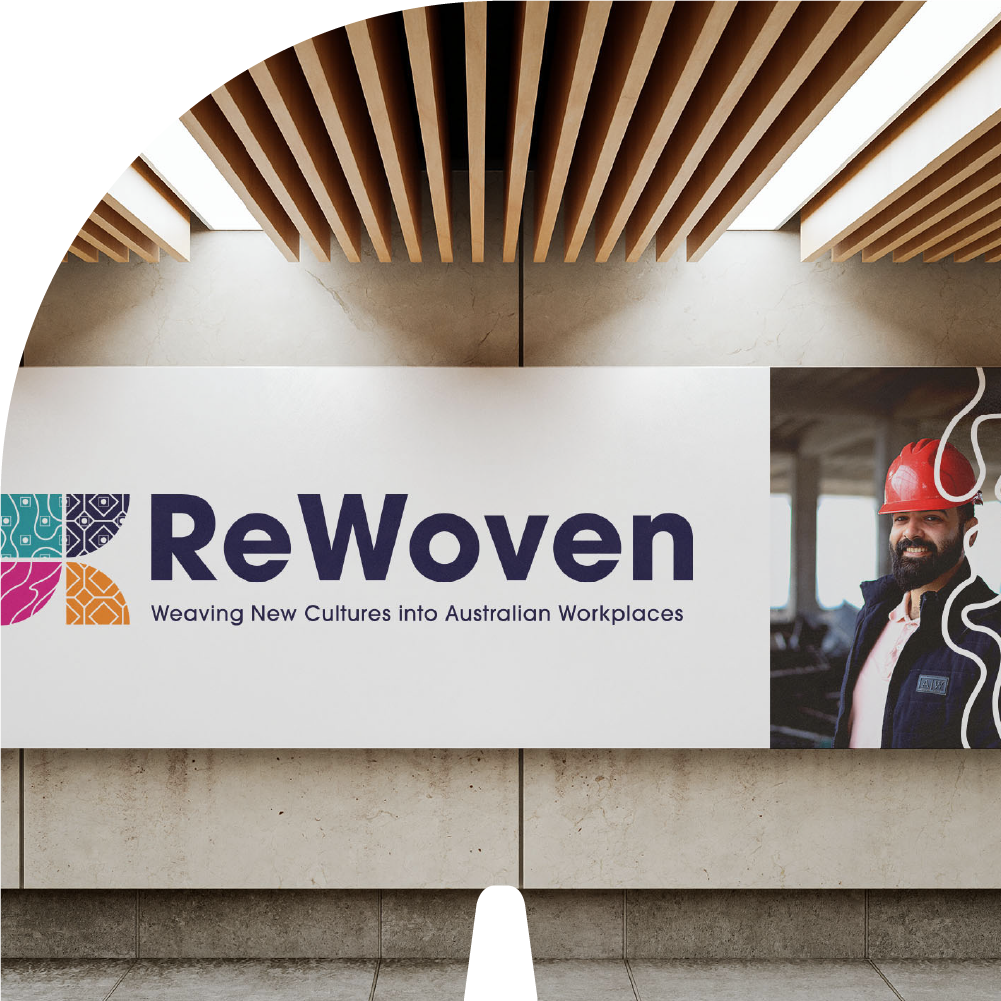 A billboard for ReWoven features their branding and a male trade worker.