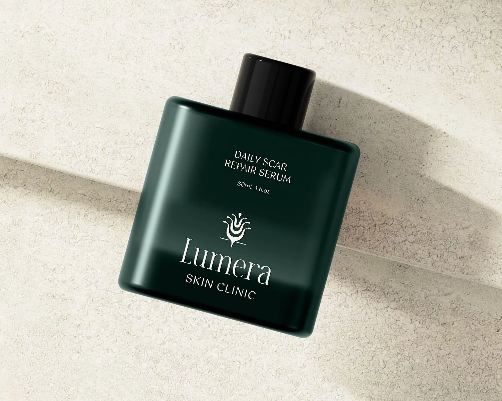 Green bottle of Lumera Skin Repair Serum resting on stone surface.