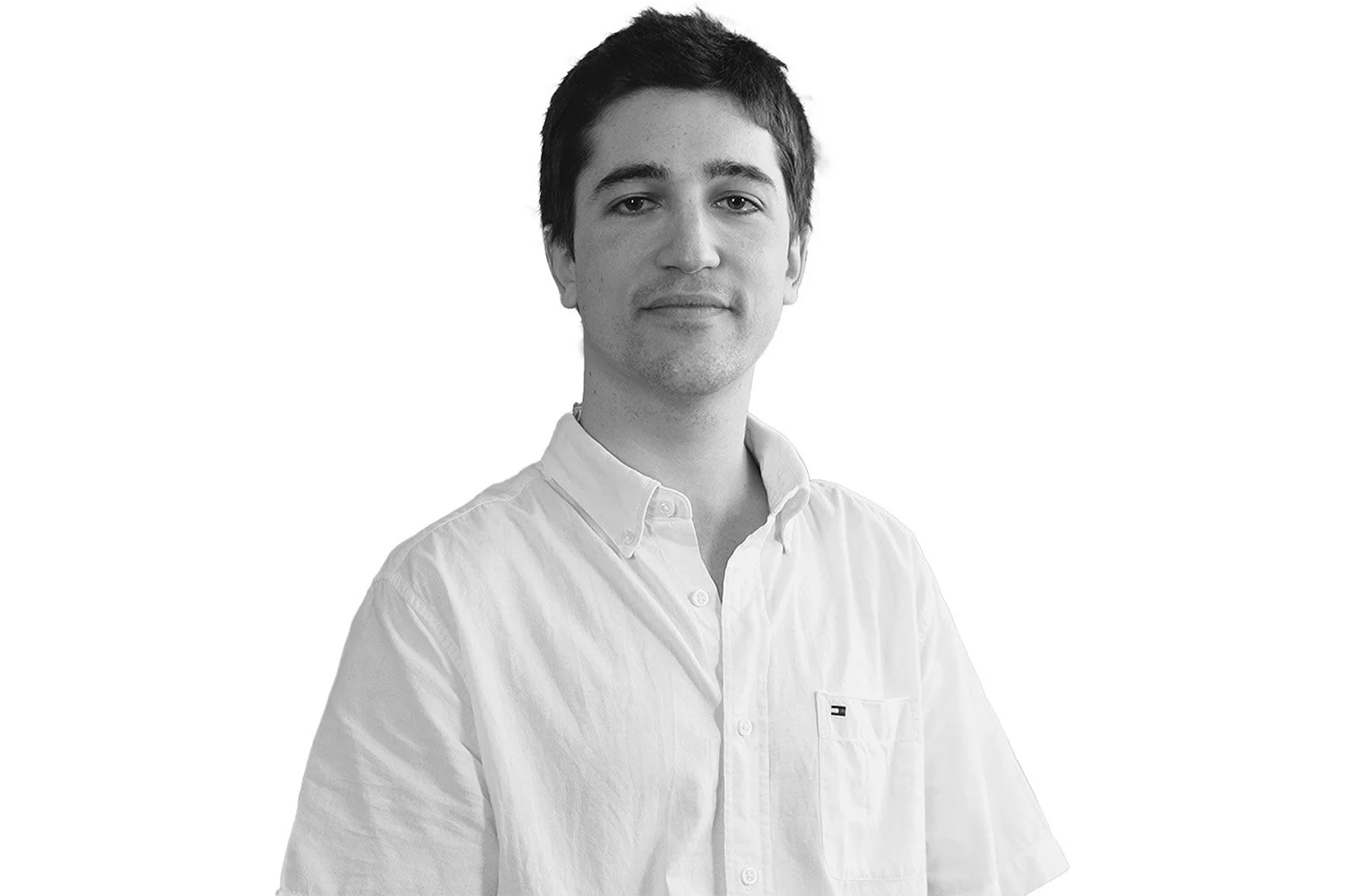 Black and white portrait of Tom Burroni, a Satellite Systems engineer at Reflex Aerospace, with short dark hair, wearing a white button-up shirt looking at the camera with a neutral expression.