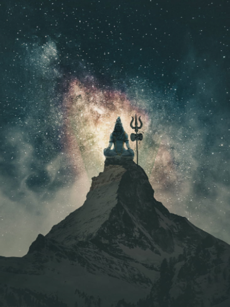 A silhouette of Lord Shiva statue sitting on a mountain peak against a starry night sky with the Milky Way galaxy in the background.