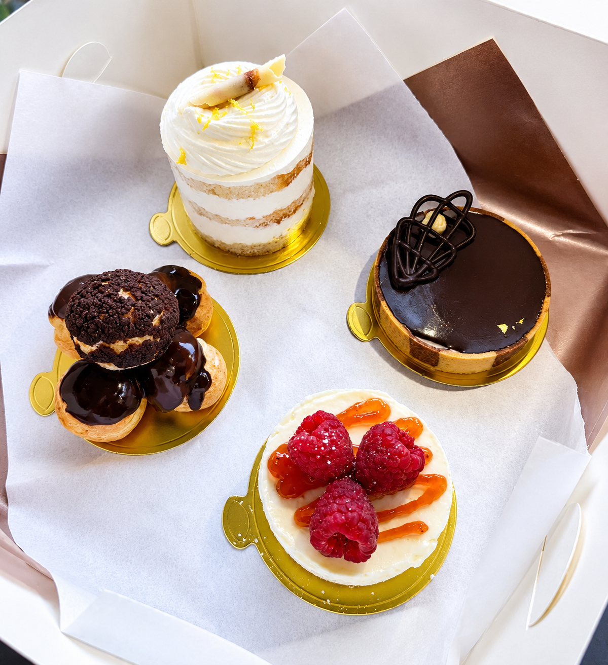 4 different cakes in a monthly patisserie box