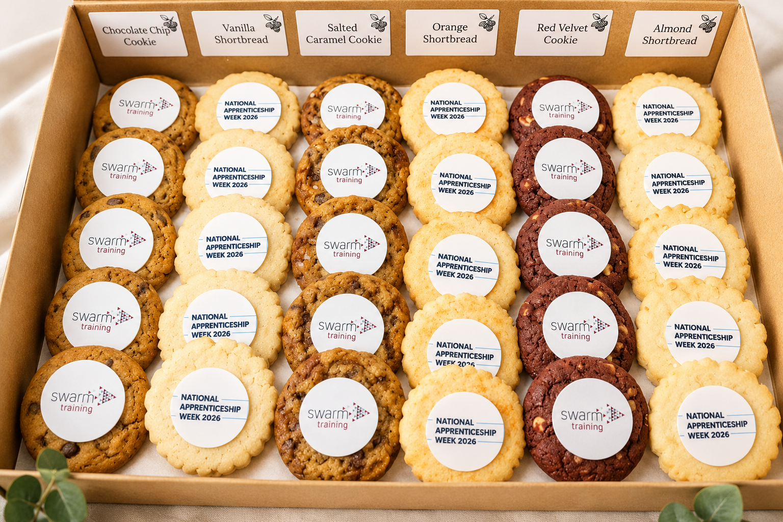 Rows of different flavoured handcrafted cookies with edible company branding on them for corporate and event catering