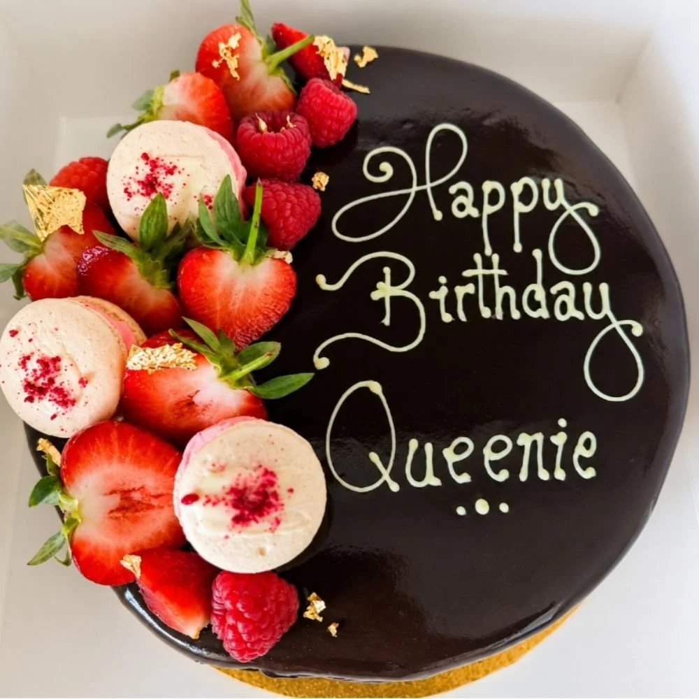 Chocolate mousse gateau with fresh fruit and Happy Birthday pipping