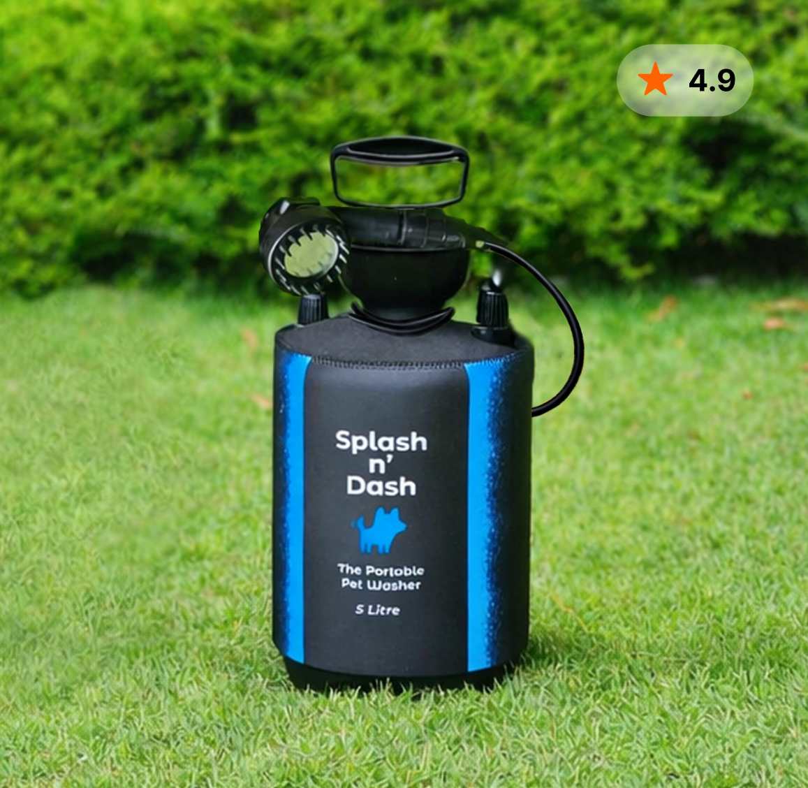 Portable pet washer labeled 'Splash n' Dash' on grassy lawn with green bushes in background.