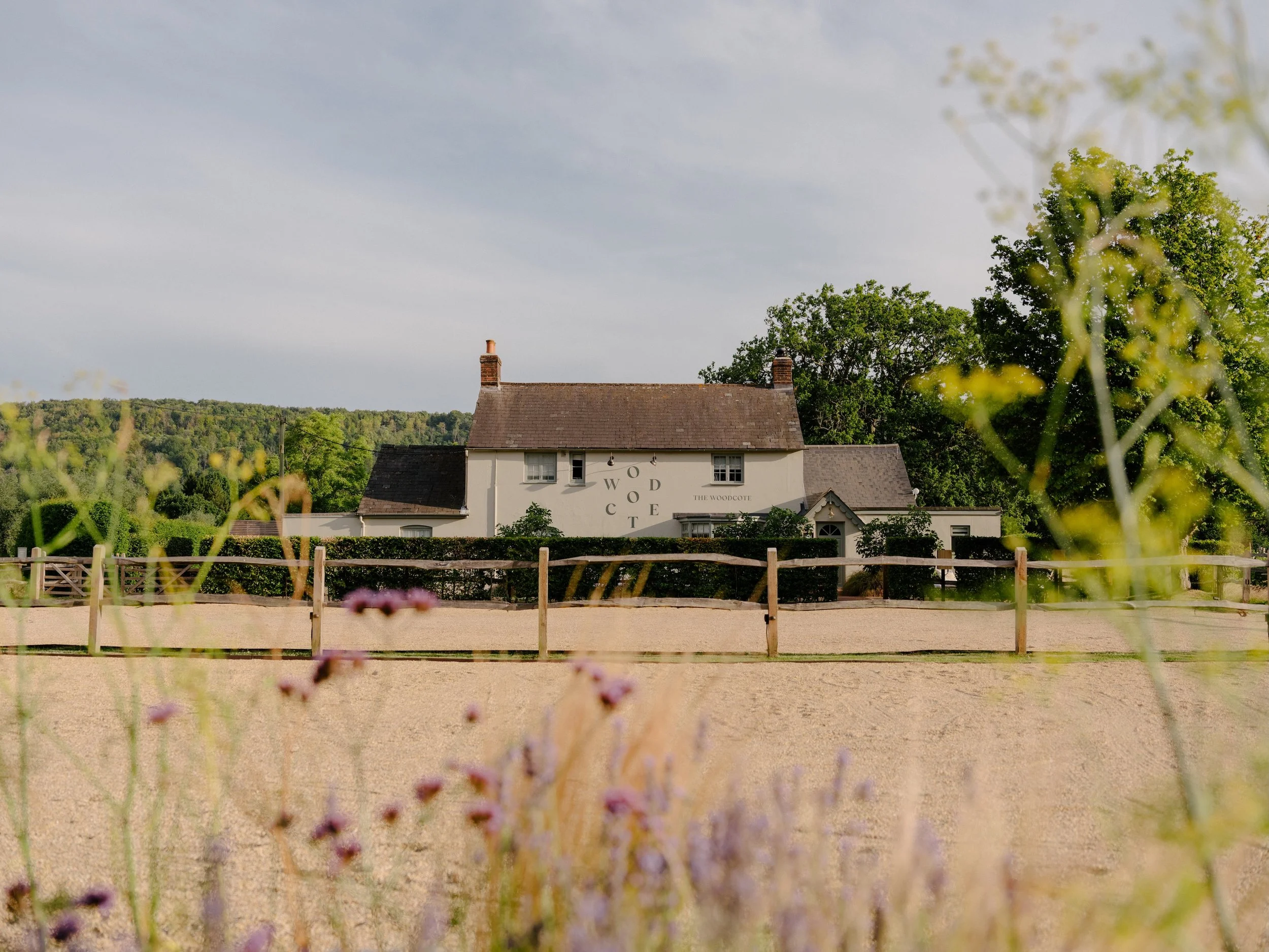 Exterior of The Woodcote restaurant and rooms in Graffham, West Sussex, set in the South Downs countryside.
