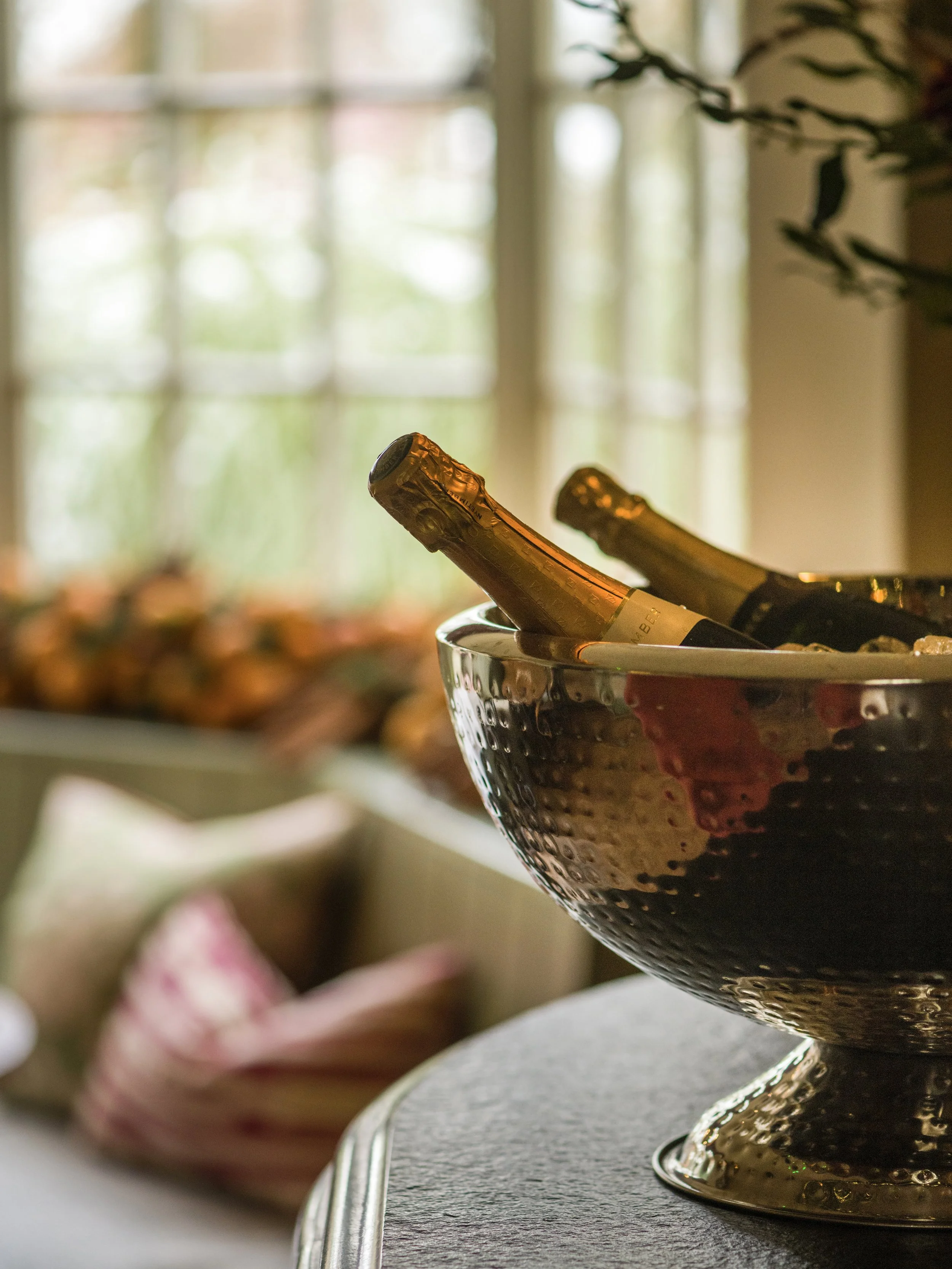 Chilled bottles of champagne in an ice bucket, a luxury touch for a winter stay or celebration at The Woodcote.