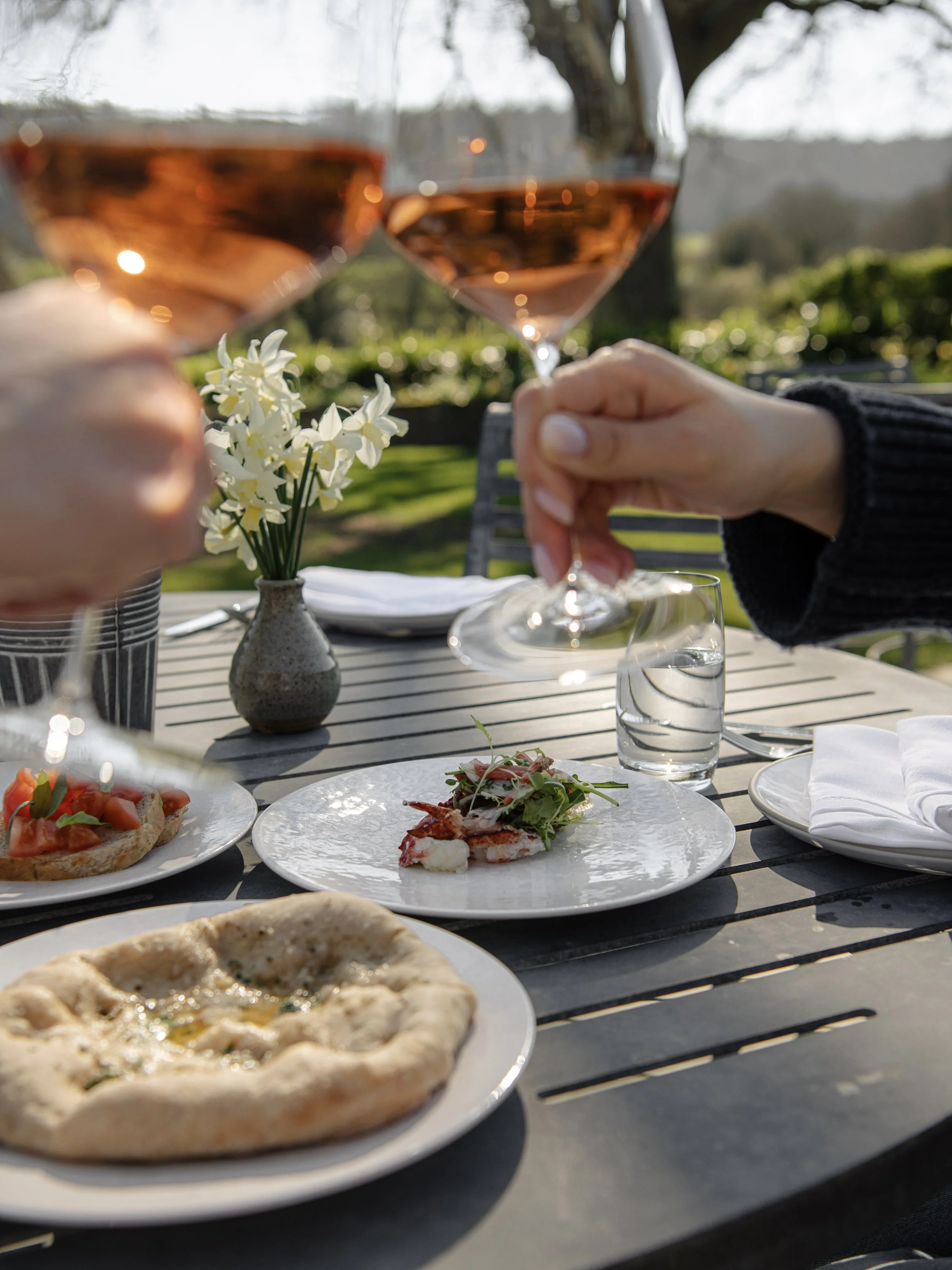Celebrating Father's Day at Woodcote with rose wine and gourmet appetizers on the sunny garden terrace.