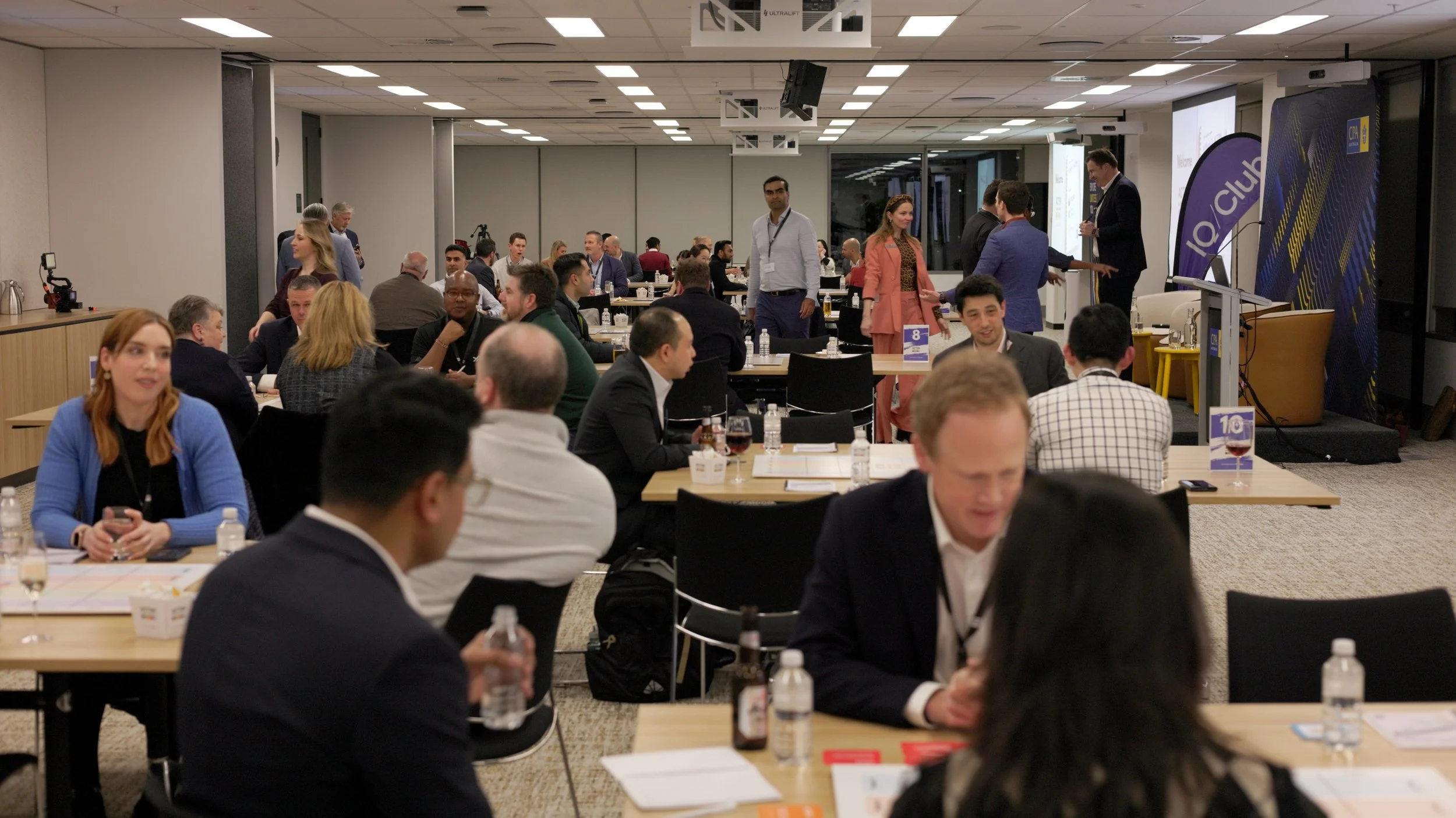 A large conference room of Melbourne finance professionals attending a business networking event.