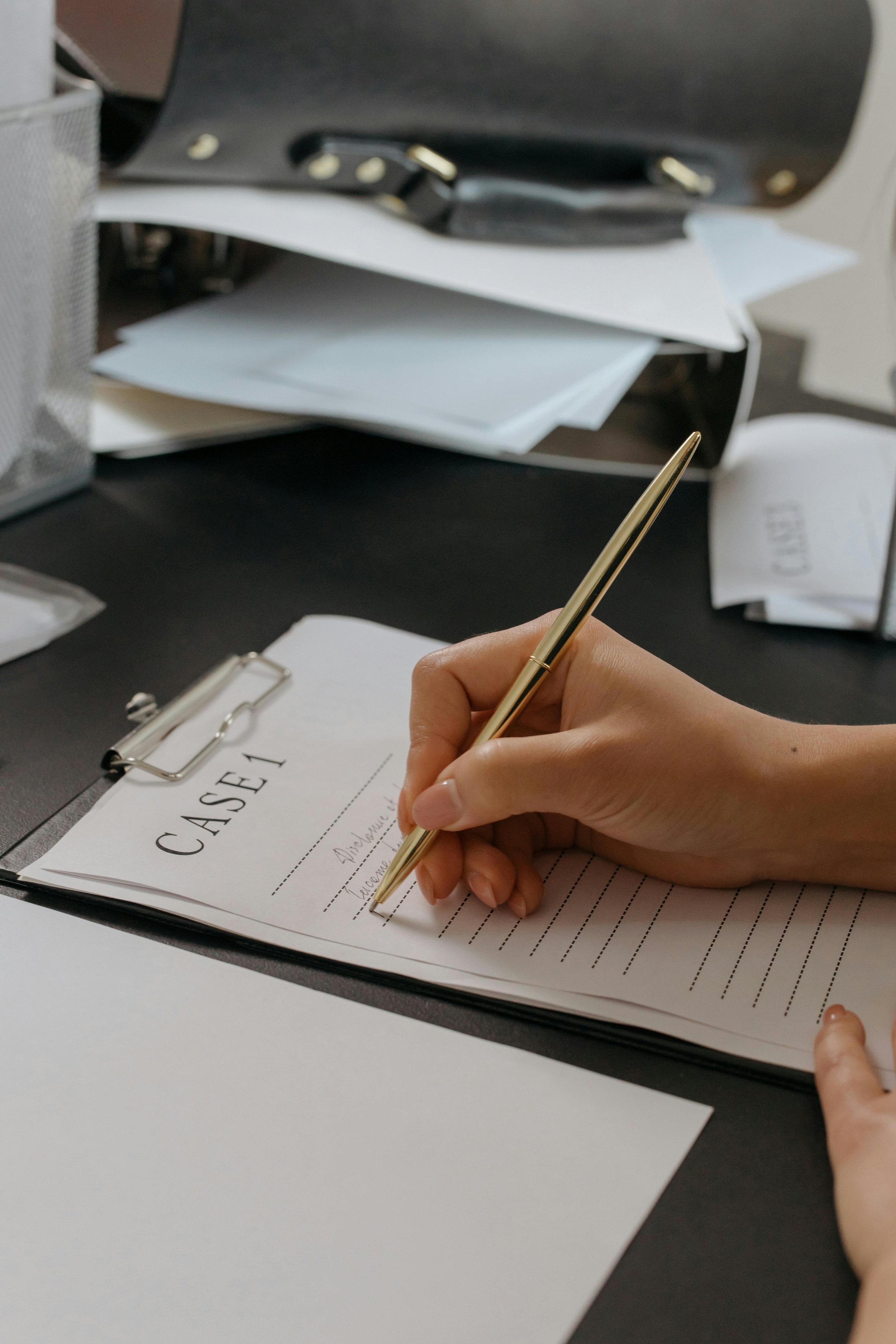Person writing case study for a satisfied client, emphasizing service quality and impact