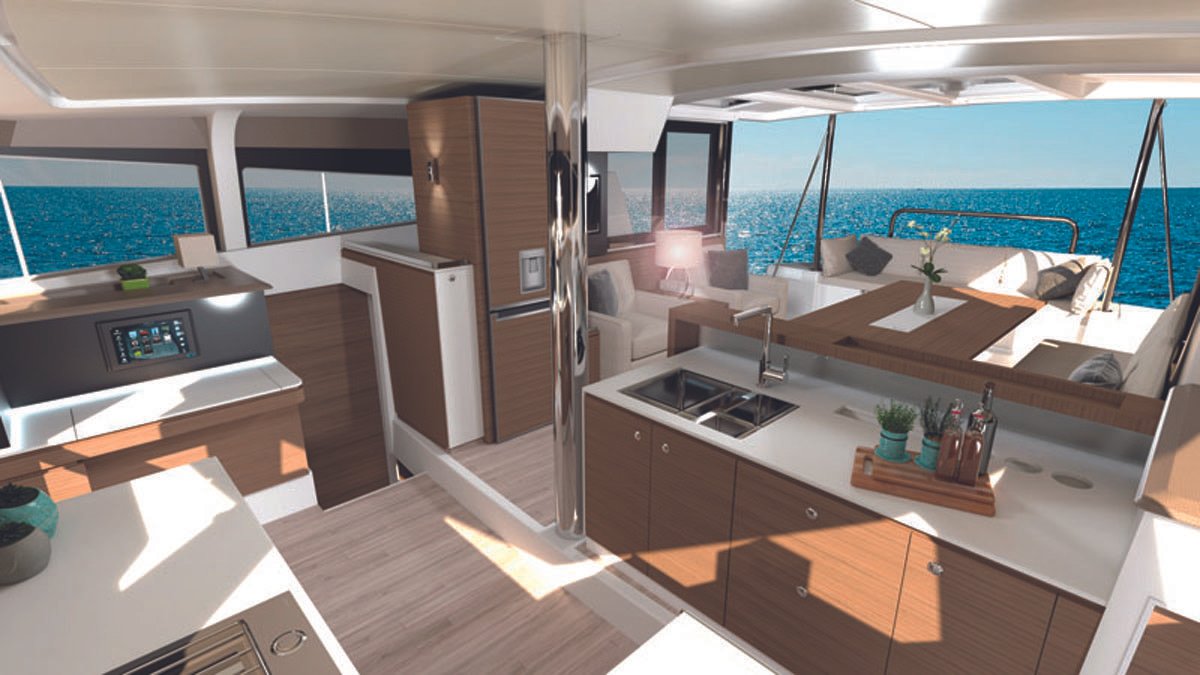 Interior of a luxury yacht with modern kitchen and ocean view.