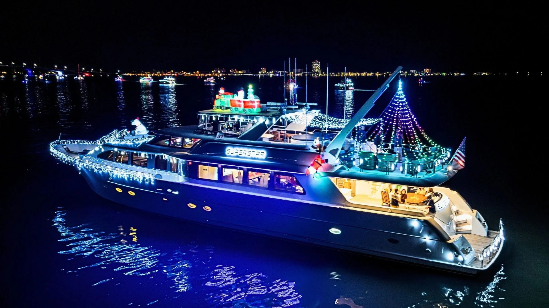 Superstar luxury yacht from Kokomo Charters cruising Sarasota Bay – perfect for New Year’s Eve private yacht charters, sunset cruises, and luxury boat rentals in Sarasota and Siesta Key.