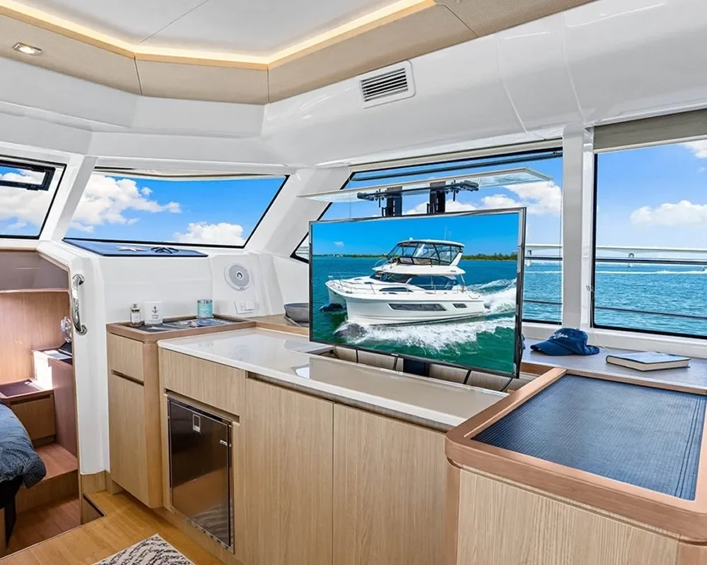 Corporate Outings – Sarasota Bay – luxury yacht cruising with American flag flying, perfect for corporate events.