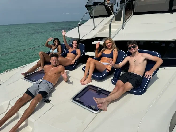 Guests sunbathing on a yacht bow