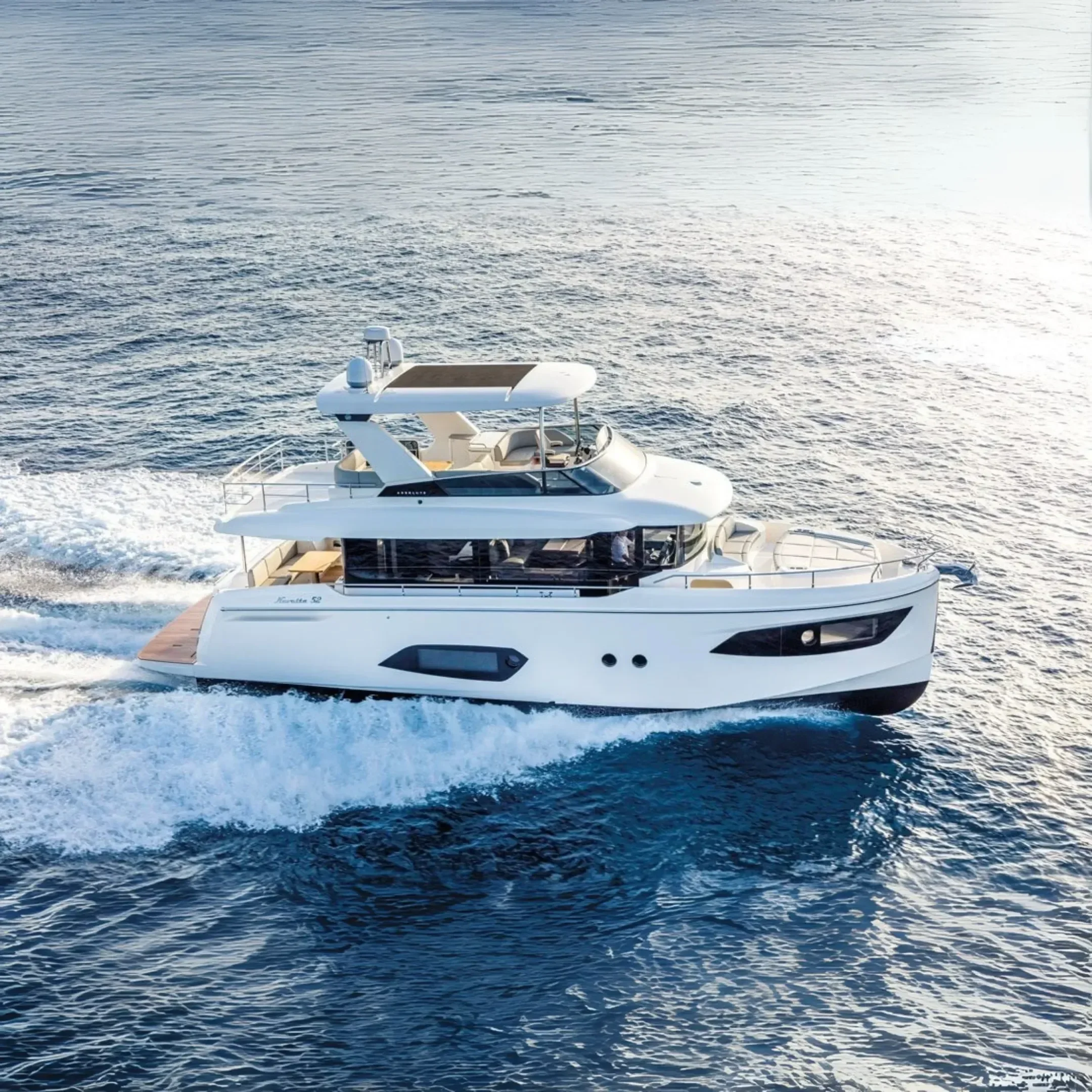 kokomo charters - 52' Rally Point - A white luxury yacht sailing on the ocean during the daytime.