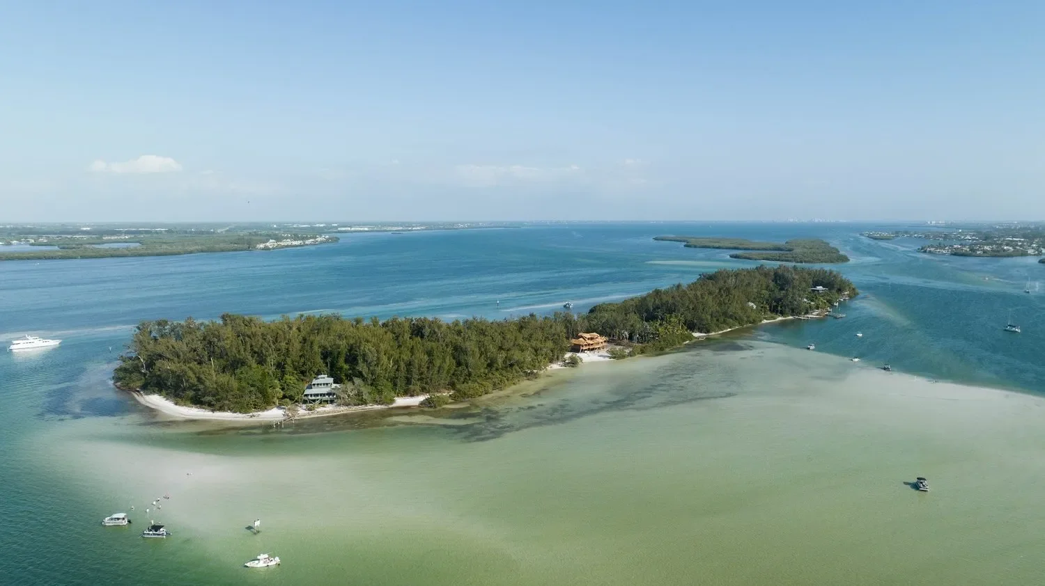 things to do in Anna Maria – Jewfish Key – panoramic aerial of Jewfish Key’s waterfront homes and blue Gulf waters.