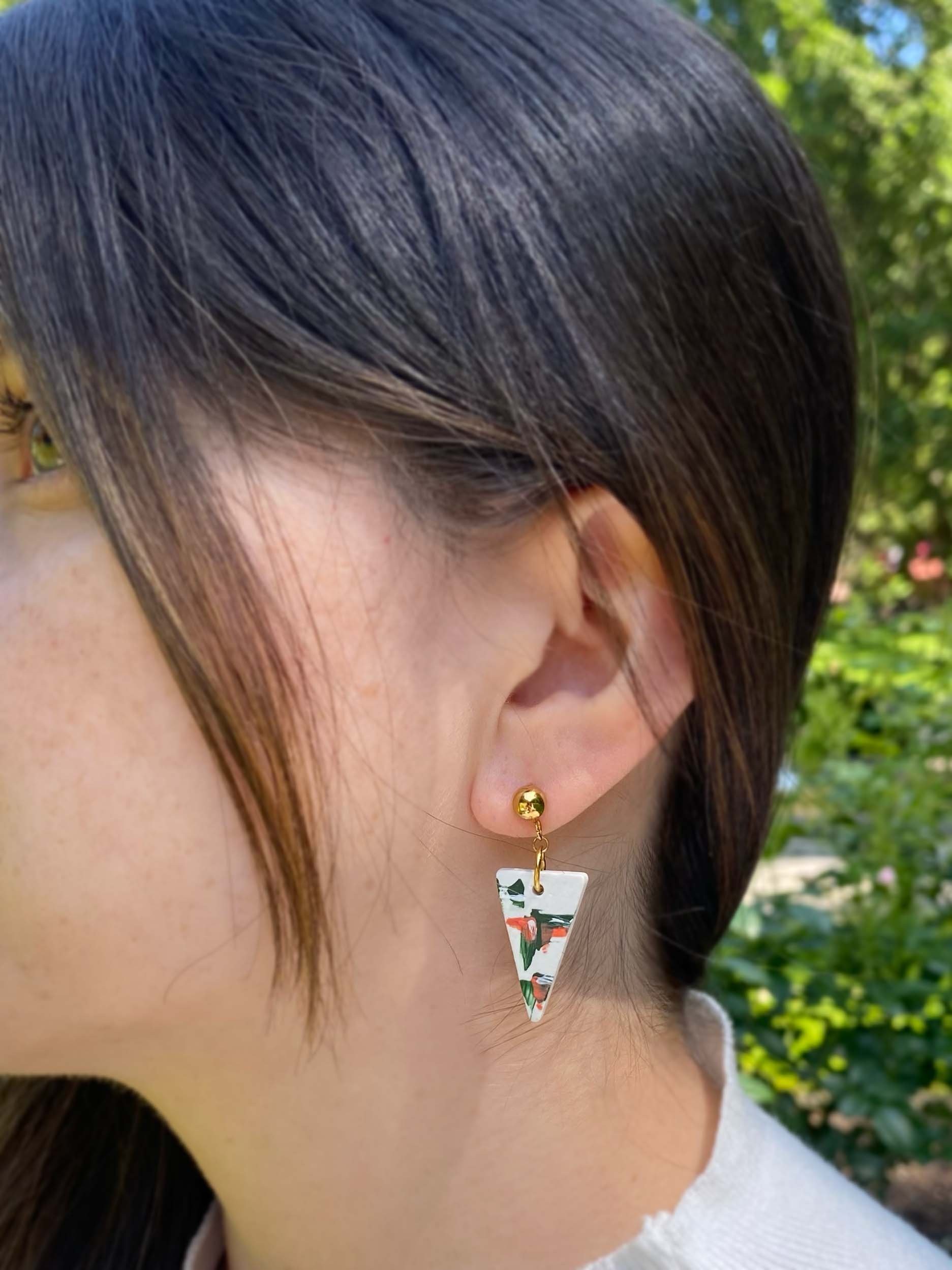 white earrings green and orange hand painted person.jpg