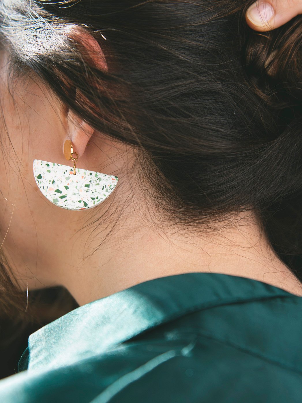 big white earrings green and salmon terrazo golden person.jpg