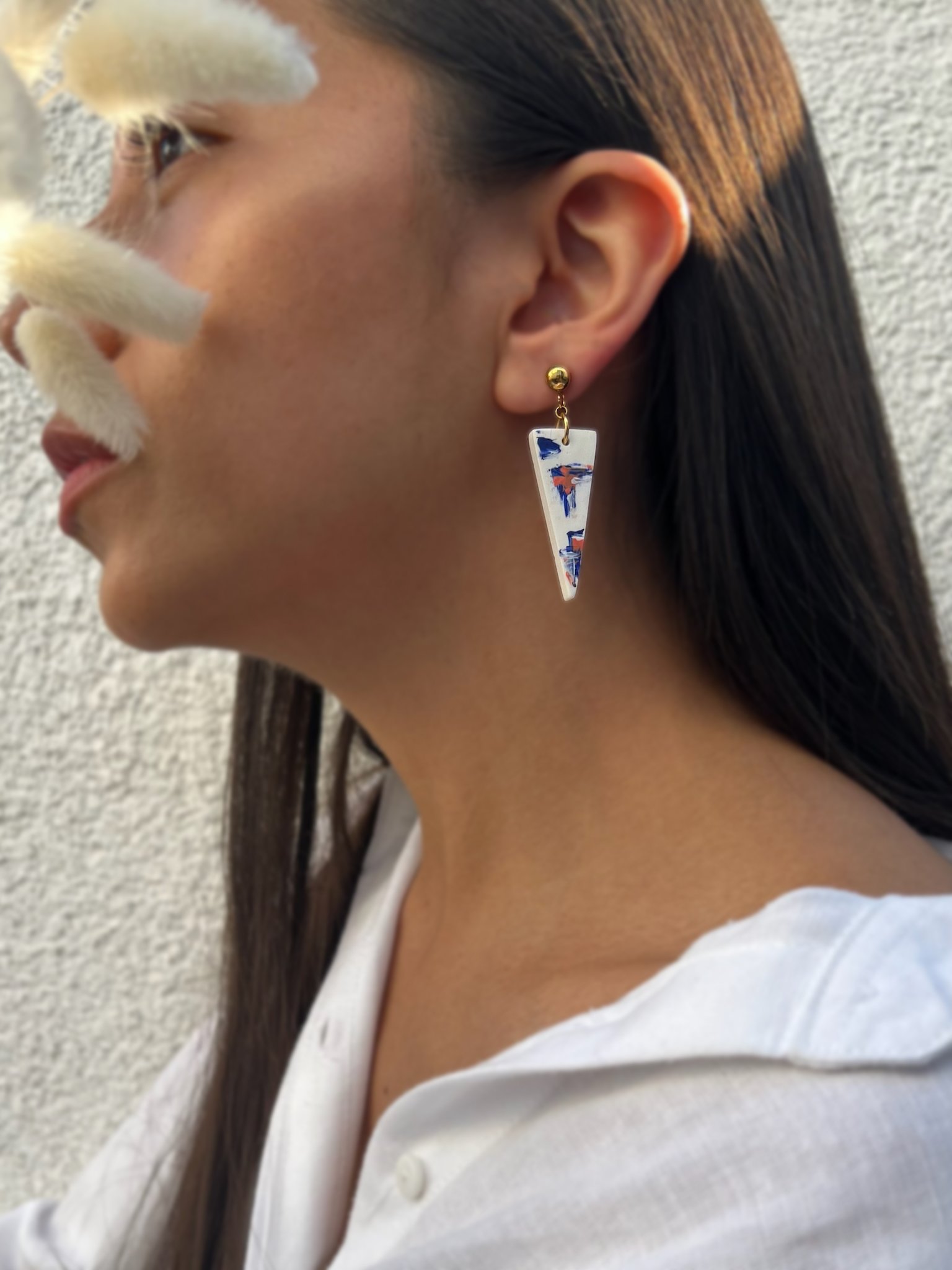 white earrings blue and orange hand painted person.jpg