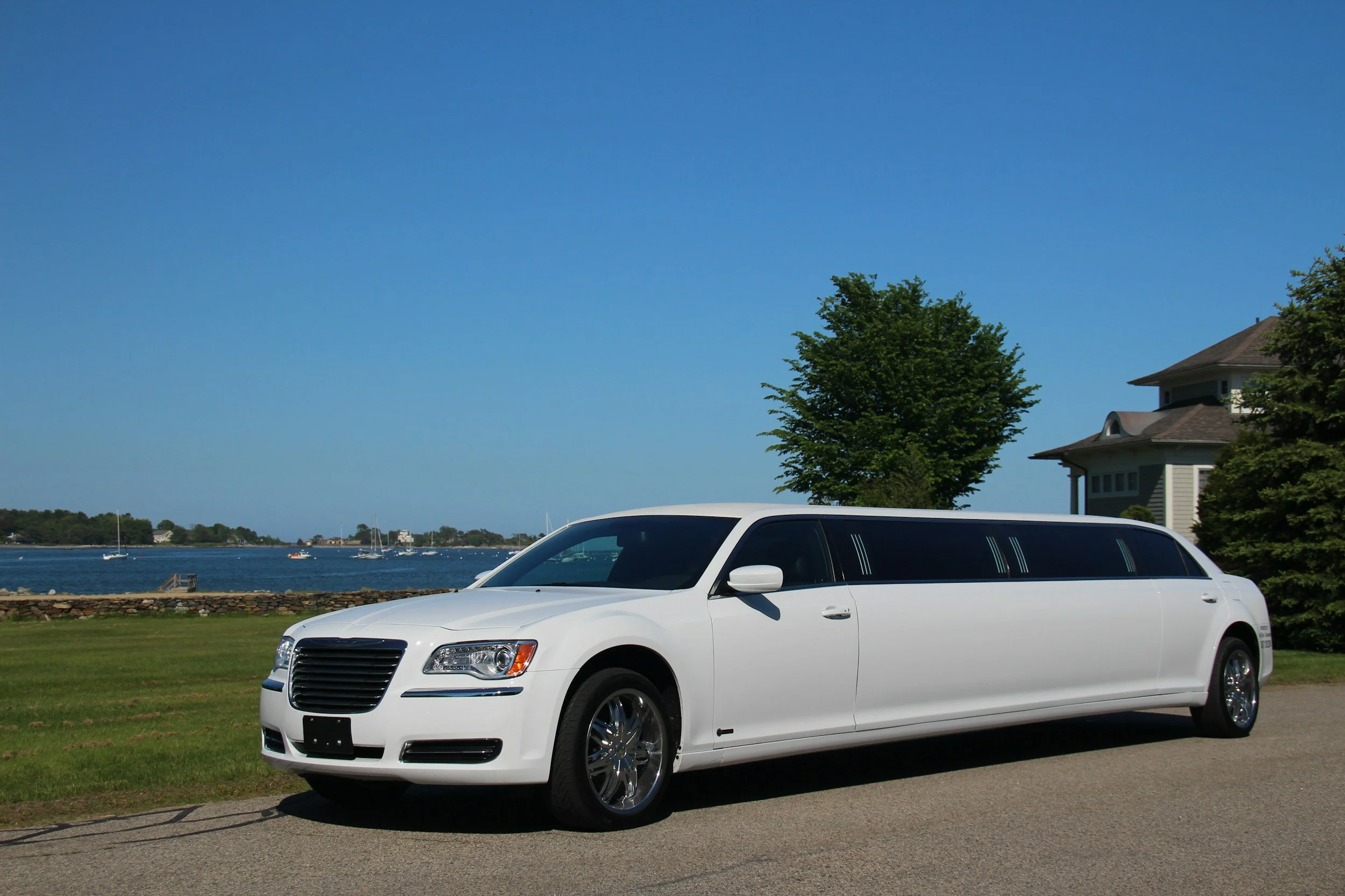 White stretch limo at oceanfront venue