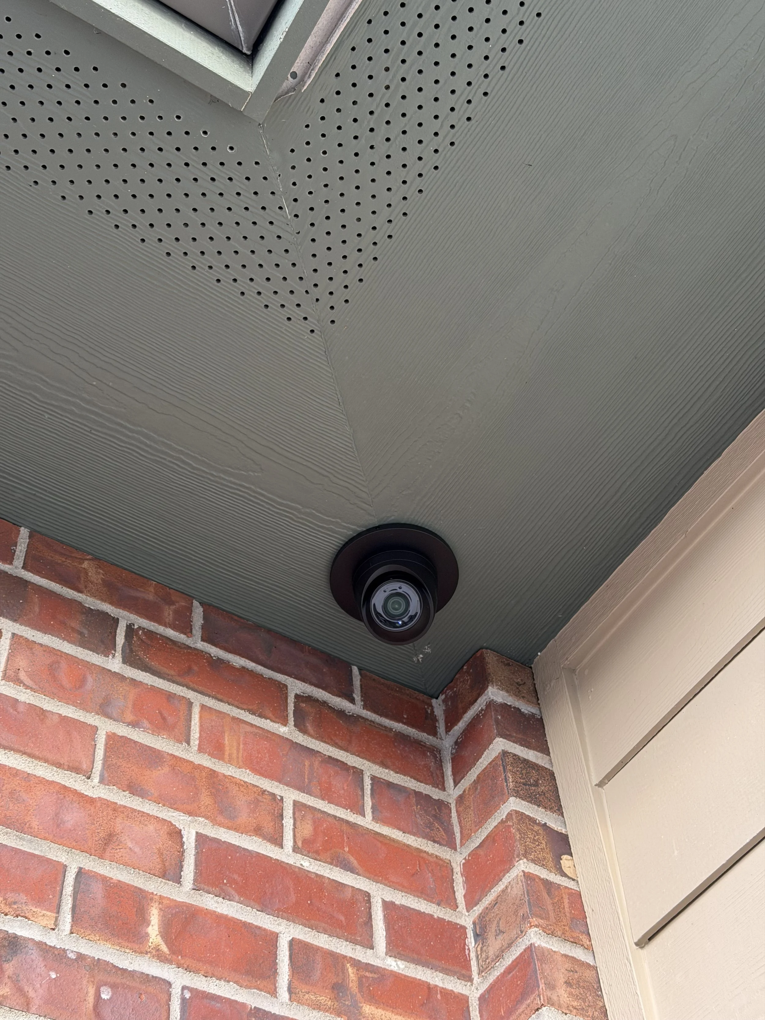 Access control card readers mounted on a brick exterior by Big Sky Wired