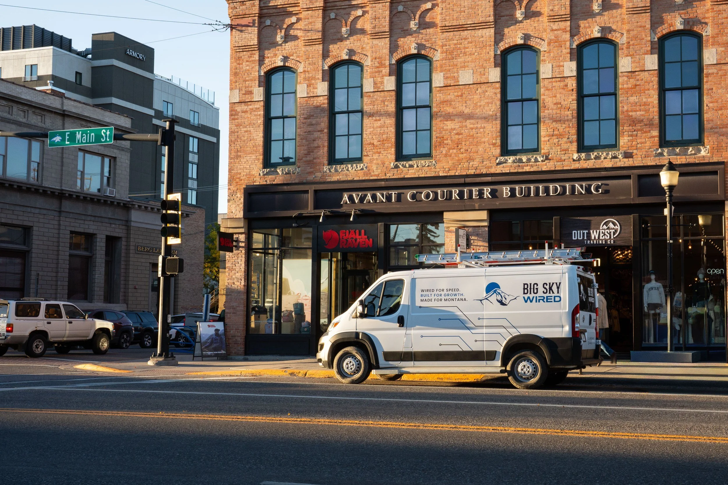 Big Sky Wired work van parked on Main Street in downtown Bozeman