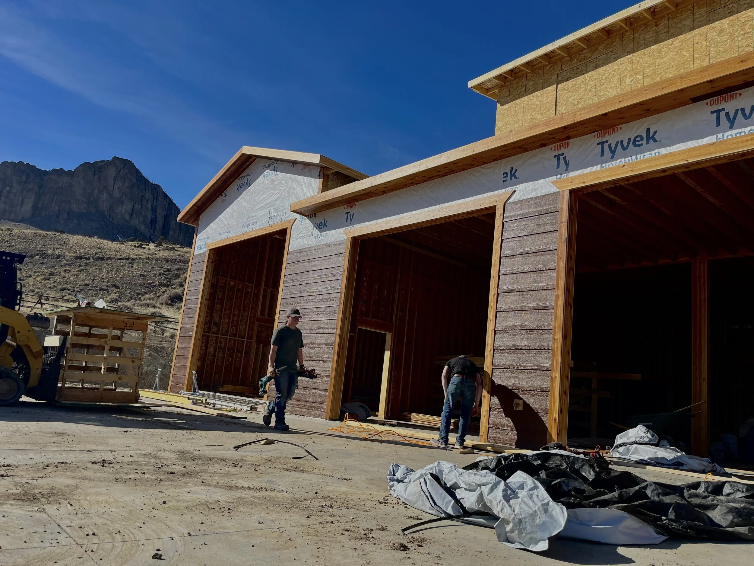 Oranssi technician working on a roof project