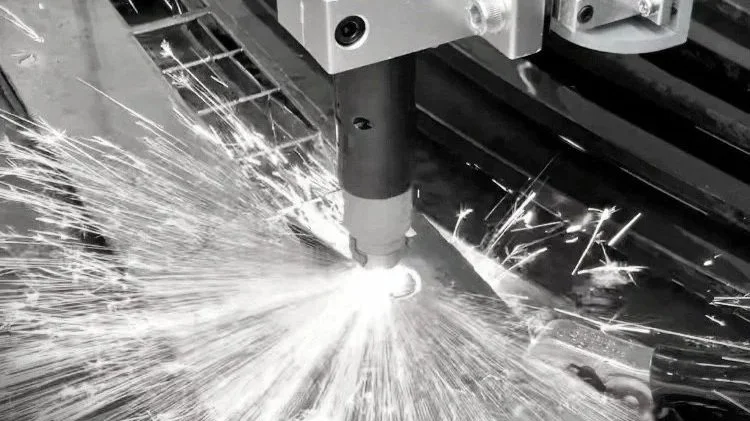 A plasma cutter in operation, cutting through a sheet of metal, with sparks flying.