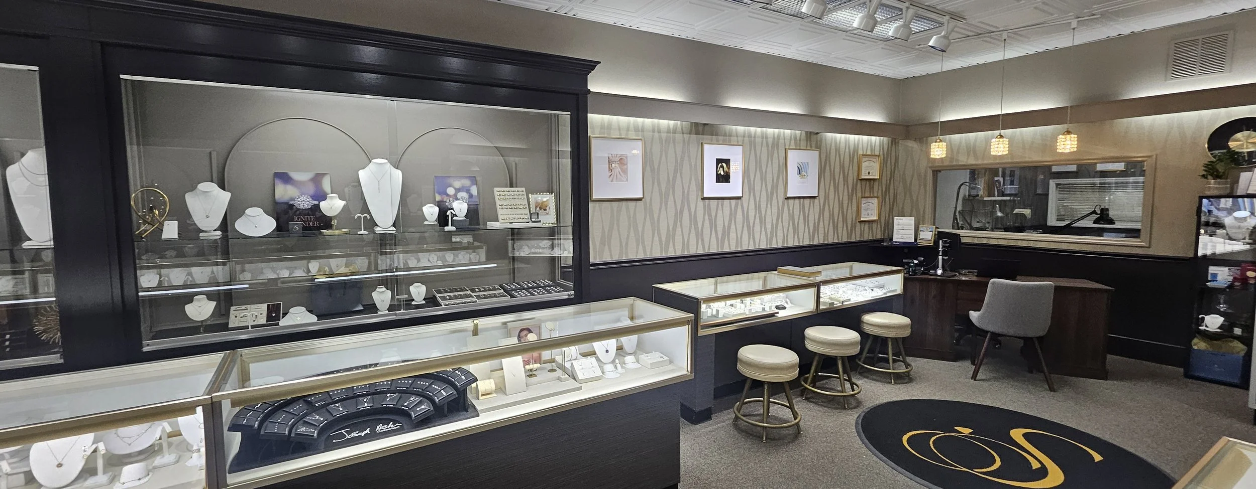 Jewelry display cases and seating area inside a jewelry store.
