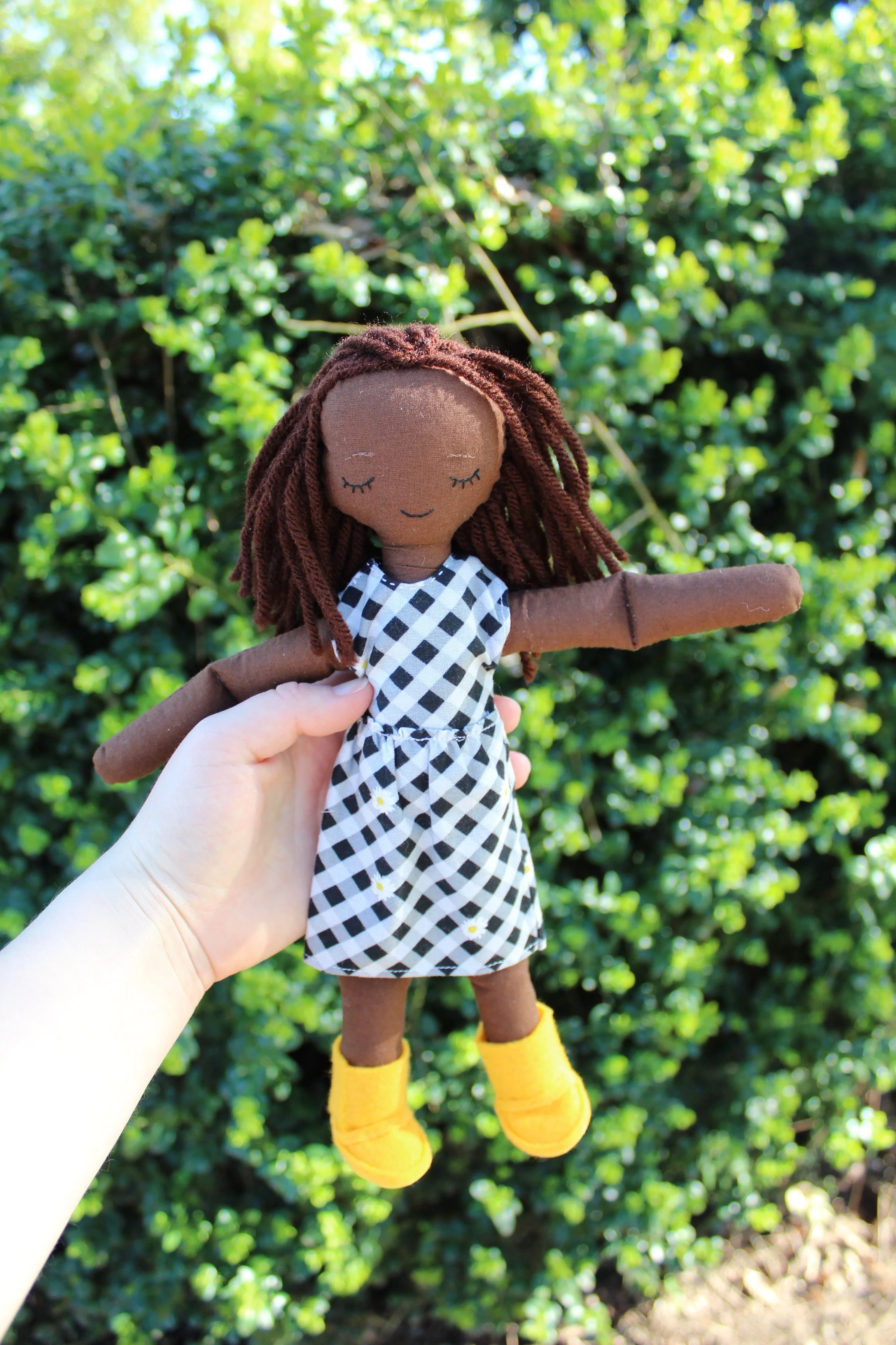 Doll with Black and White Daisy Dress