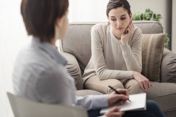 Supportive therapy session where a compassionate clinician guides clients through coping strategies for ADHD, trauma recovery, and emotional regulation in a safe, collaborative environment.EMDR and DBT