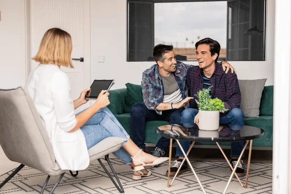 Couple attending trauma-informed couples counseling session LGBTQ same sex marriage