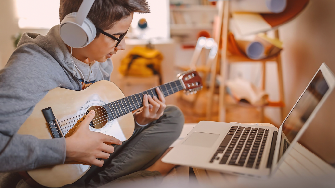 Young Adult Learning Guitar Online