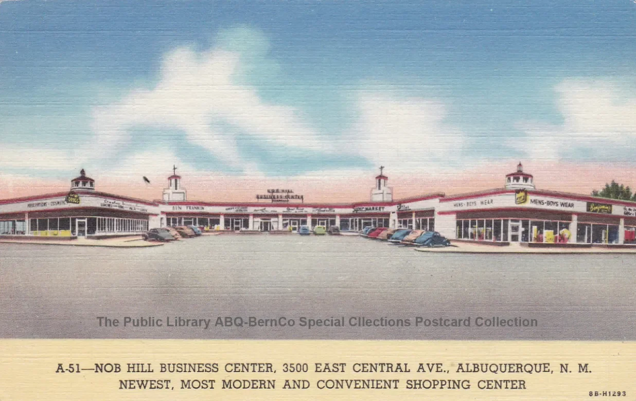 An illustration of a shopping center with parking lot, retail stores, and a clear sky.