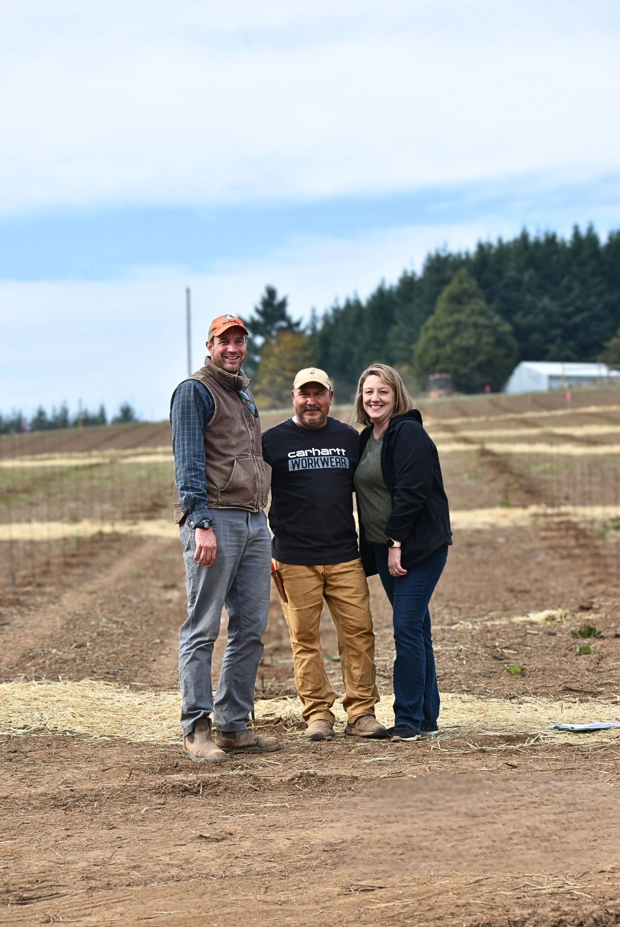 peter ebbers, juan cruz and kelly peters - team at SWiG posing at vineyard