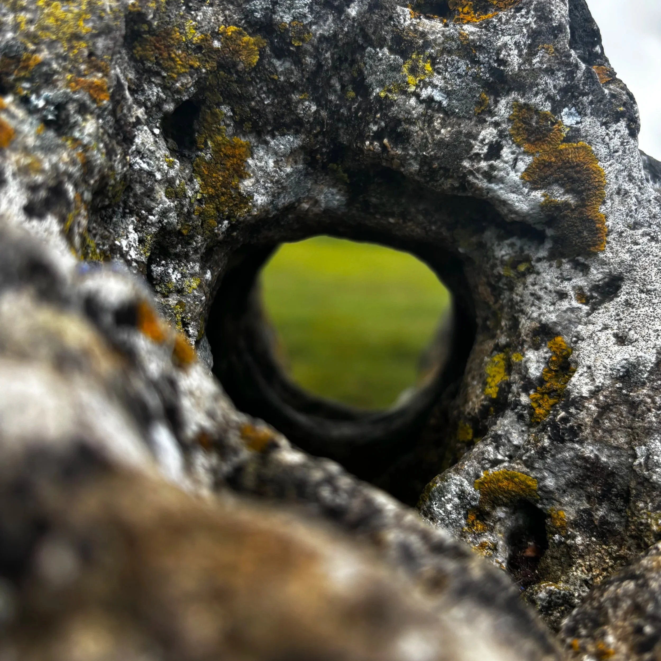 A close up of a hole bored through one of the Rollright Stones in the Cotswolds