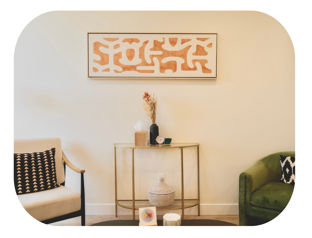 Two empty chairs and a center console with decor, as seen from the client's couch