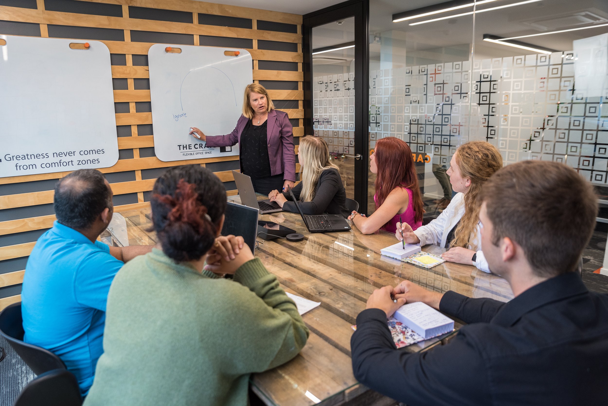Mel Rowsell facilitating an On Point Conversations workshop, using warm, human energy to help people move from avoiding or reacting to truly exploring tough conversations