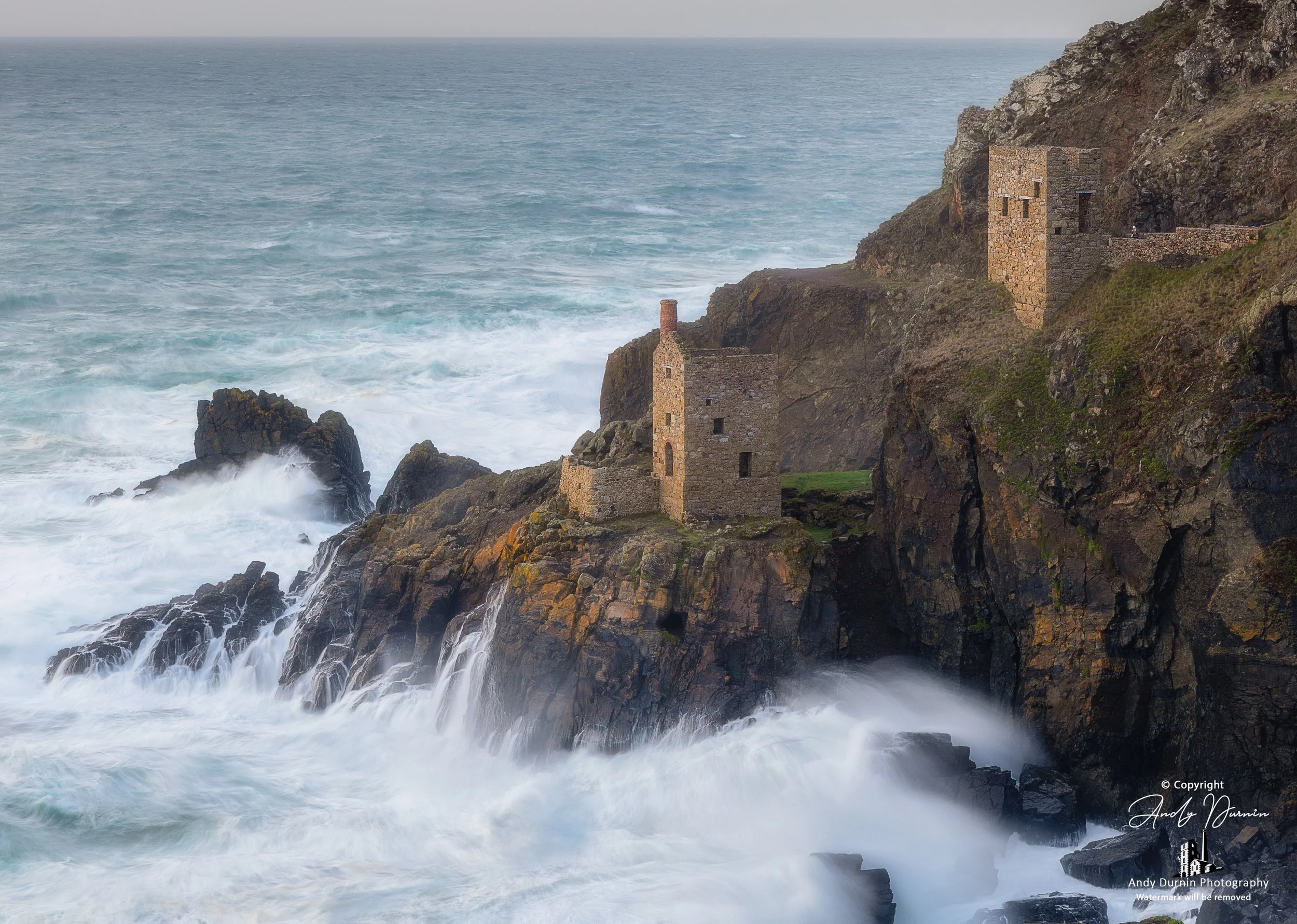 Powerful Atlantic waves crashing beneath Botallack Crowns engine houses in Cornwall.