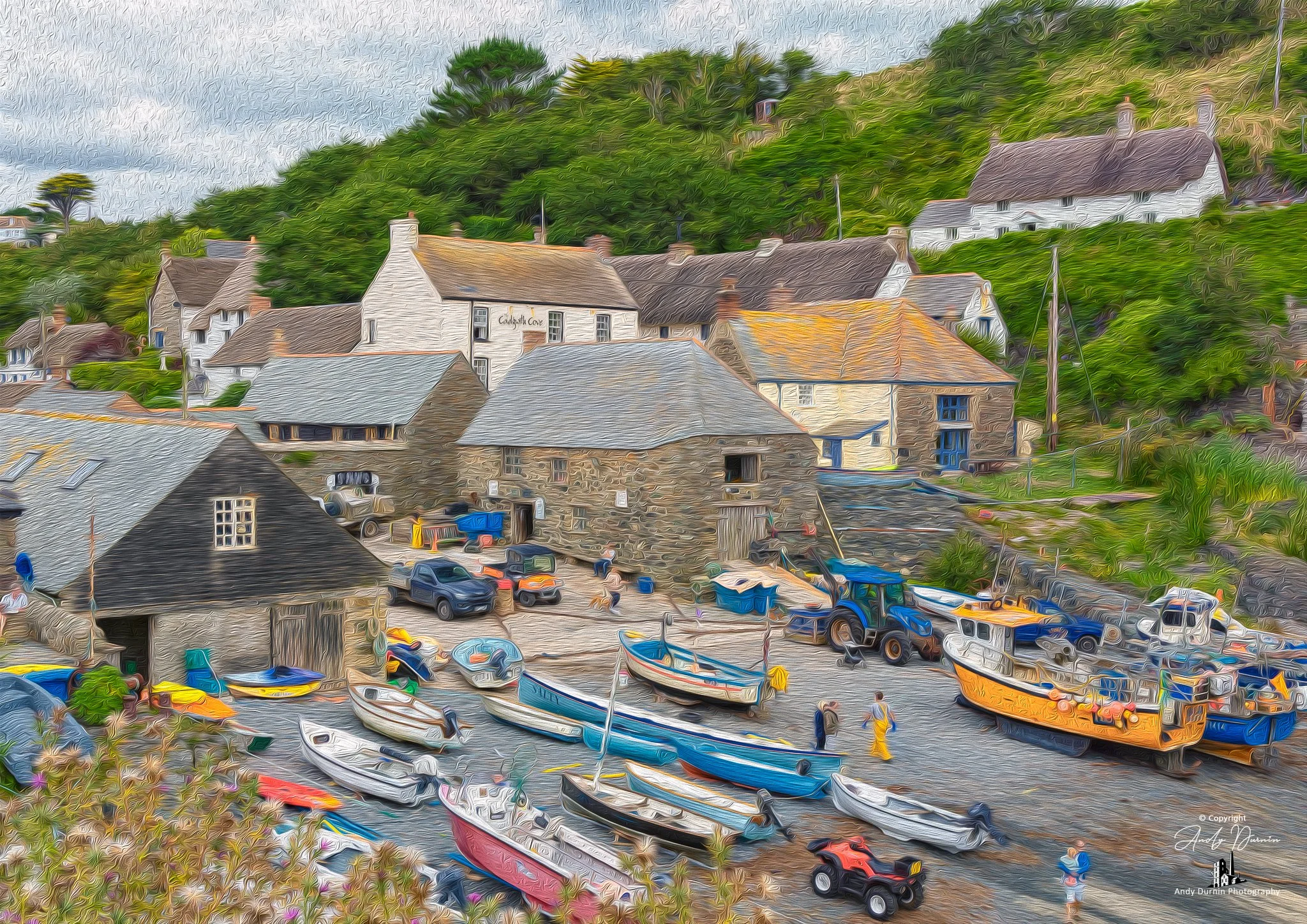 Cadgwith Cove A colourful scene of a harbour with boats, buildings, and greenery on a hillside.
