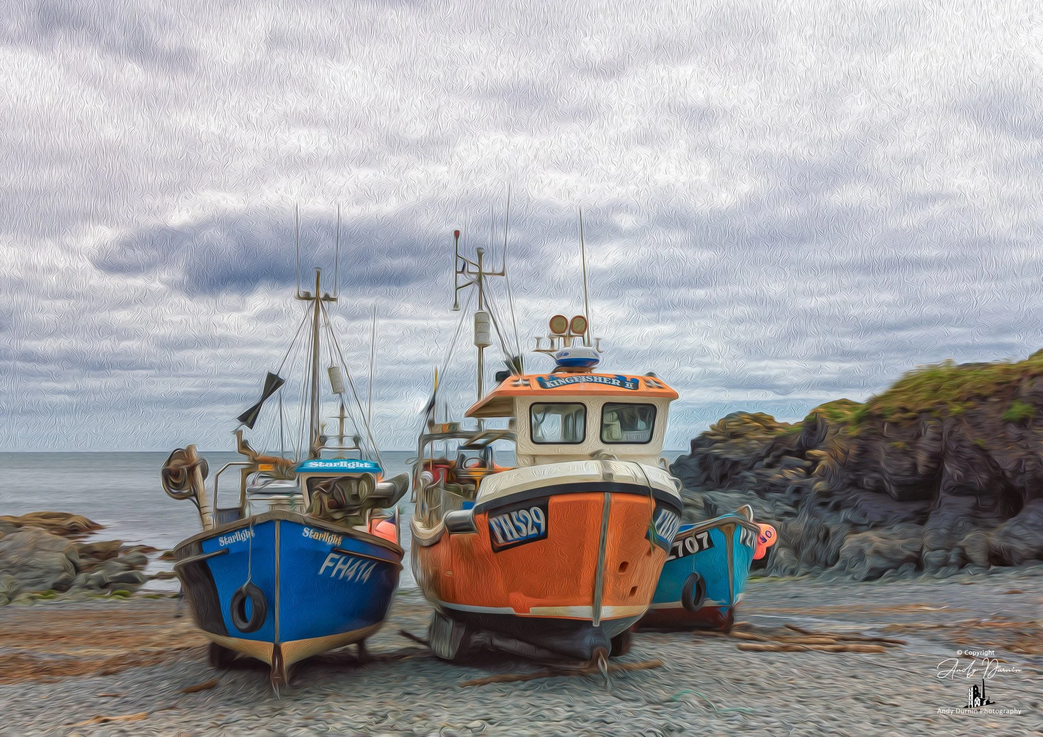 Fishing Boats at Cadgwith Cove
A striking fine art photograph of fishing boats at Cadgwith Cove, resting on the shingle between dark rocks and the open sea. Full of colour, texture, and traditional Cornish character, this coastal print captures the t