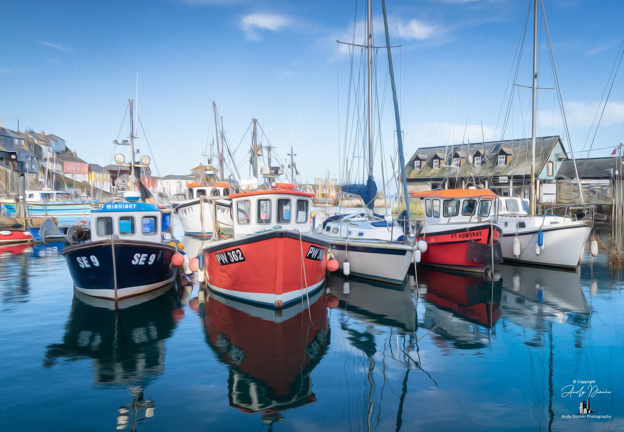 Mevagissey Harbour
A vibrant harbour photograph of Mevagissey in Cornwall, showing colourful boats resting on calm water beneath a bright sky. With strong reflections and the unmistakable charm of the working quayside, this fine art print celebrates 