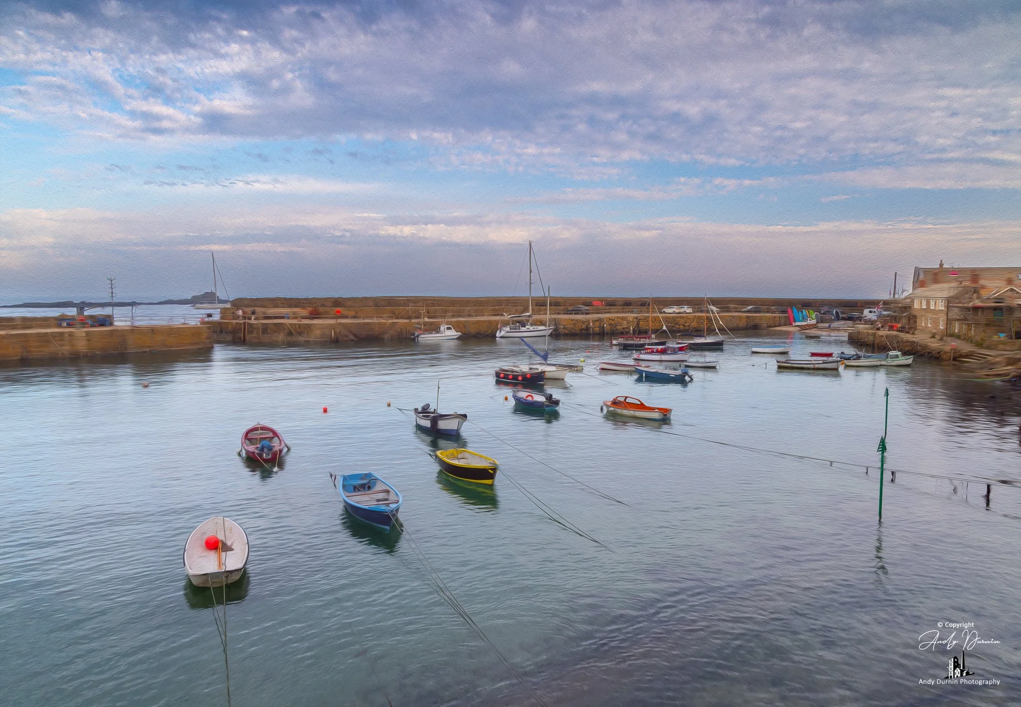 A painterly fine art print of Mousehole Harbour in Cornwall, looking towards the harbour entrance with calm water, moored fishing boats and weathered stone walls. This atmospheric Cornwall coastal photograph captures the peaceful character of Mouseho
